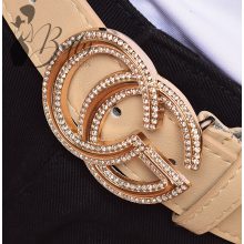 Betűmintás és strasszkő díszes csatos, műbőr öv