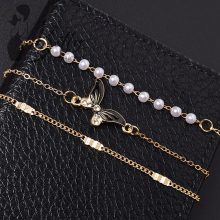 Strasszkő és gyöngydíszes, 3 részes karkötő szett