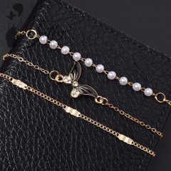 Strasszkő és gyöngydíszes, 3 részes karkötő szett