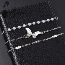 Strasszkő és gyöngydíszes, 3 részes karkötő szett